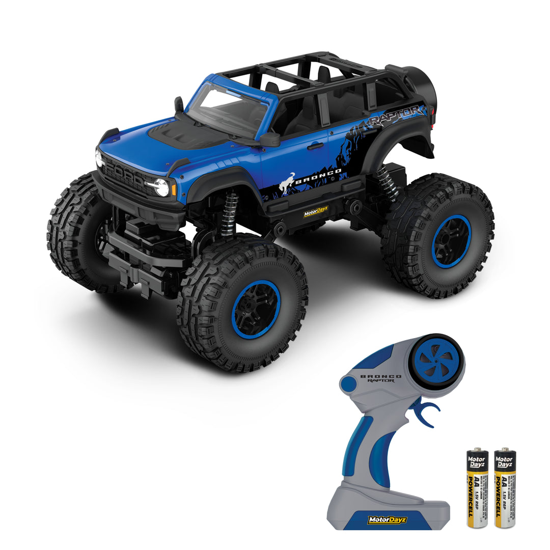 Monster truck with remote control and batteries on a white background