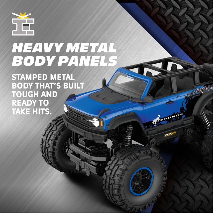 Blue toy truck with 'Heavy Metal Body Panels' text on a gray and black background