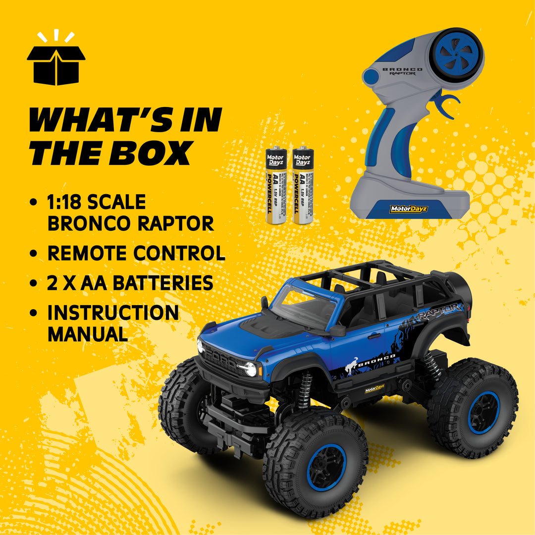 Toy truck with remote control and batteries on a yellow background