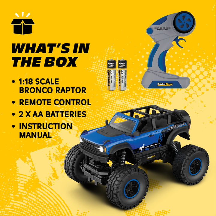 Toy truck with remote control and batteries on a yellow background