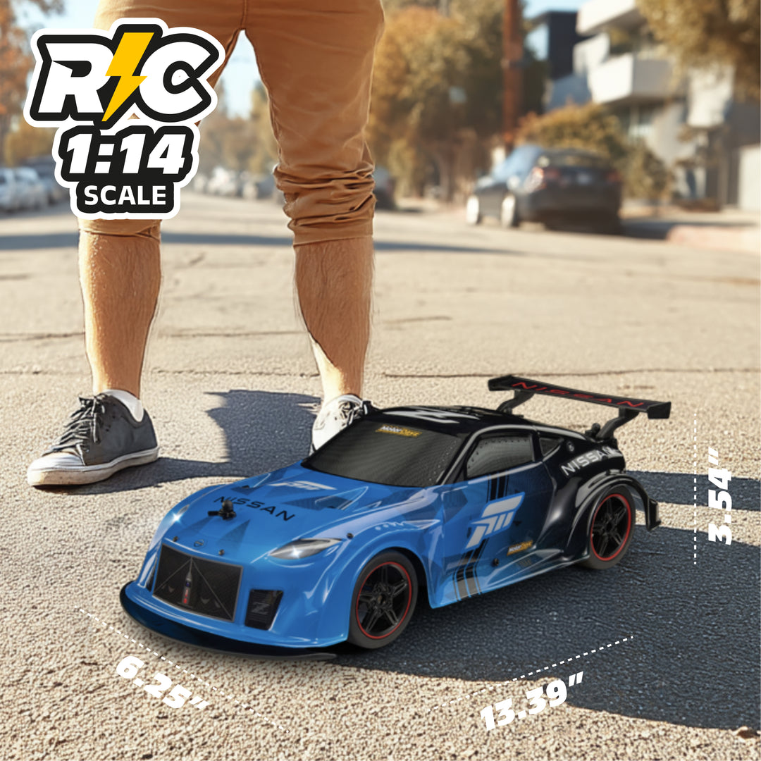 Blue RC car on a street with a person standing next to it, showing scale.