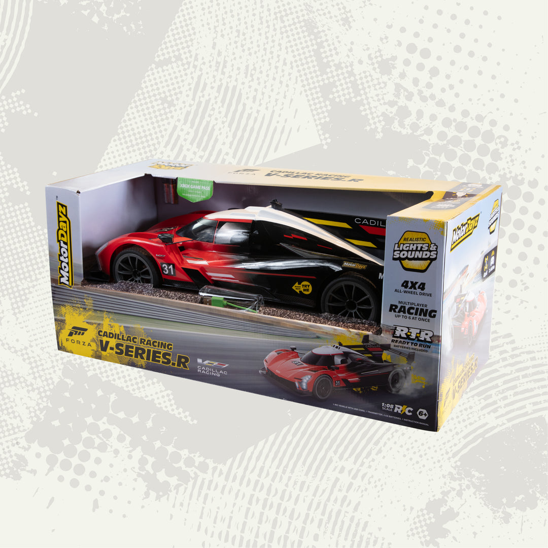 Boxed toy car with Cadillac Racing branding on a light gray background