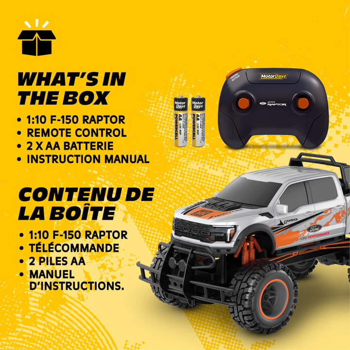 Toy truck with remote control and batteries on a yellow background