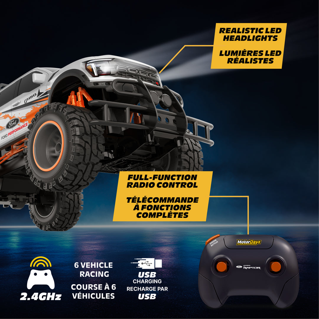 Toy truck with LED headlights and remote control on a dark background