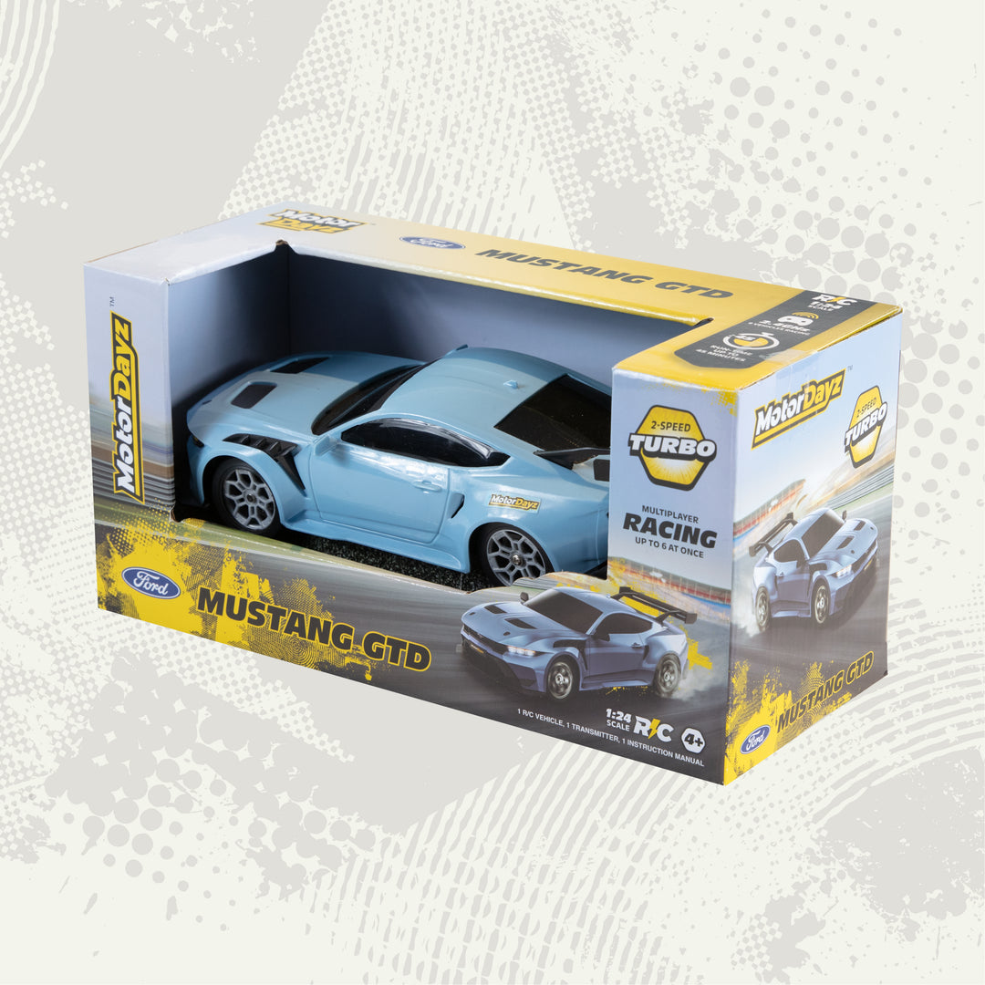 Toy car in a box with 'Mustang GTD' branding on a light gray background