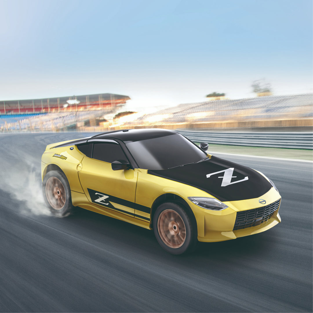 Yellow sports car with a black roof on a racetrack