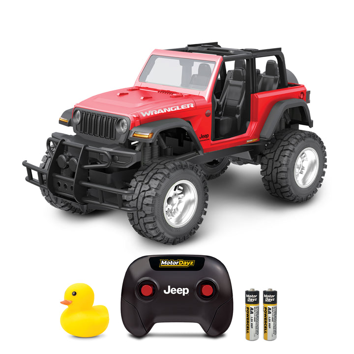 Red |  toy Jeep Wrangler with black roof, remote control, batteries, and rubber duck on a white background