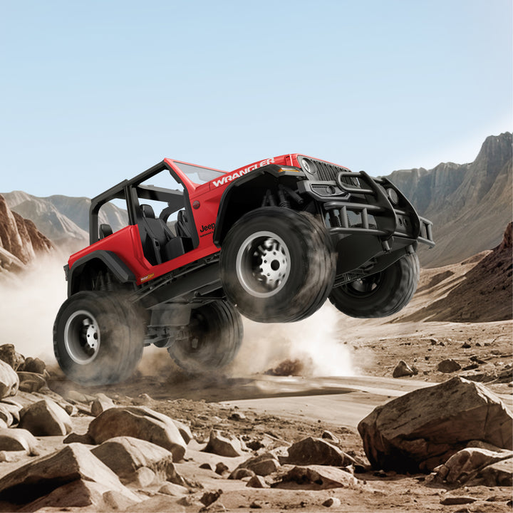 Red | off-road vehicle in a desert landscape with mountains in the background