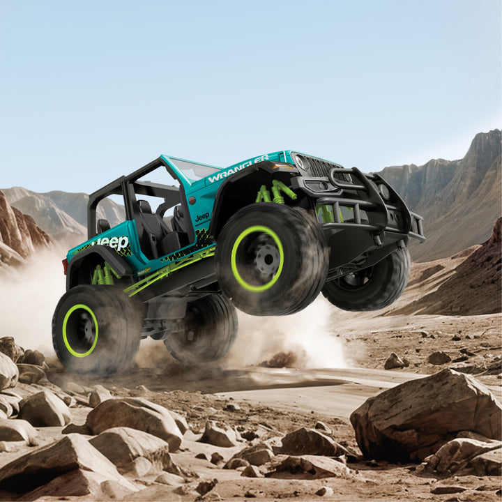 Teal | Jeep Wrangler Unlimited Rubicon X in teal and black driving on rocky terrain with mountains in the background