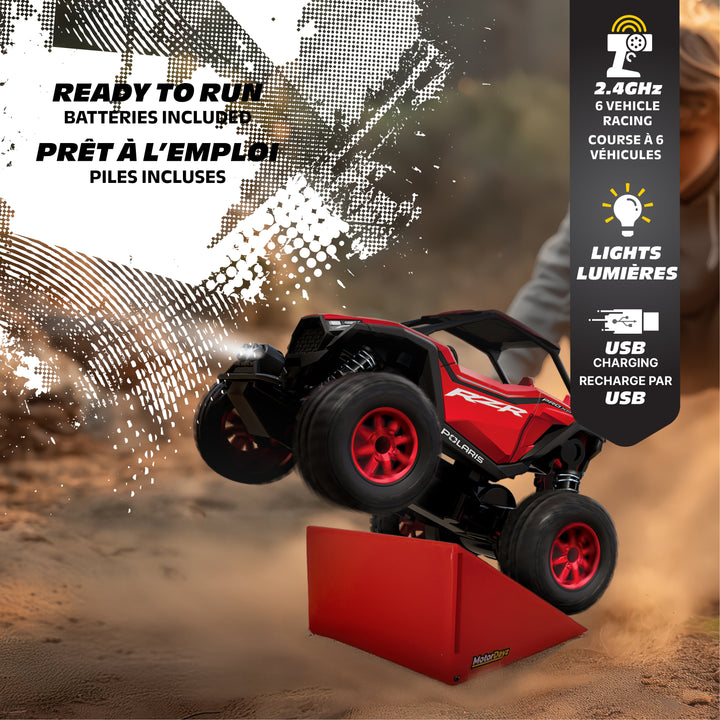 Red remote control car on a dirt track with features highlighted on the right side.