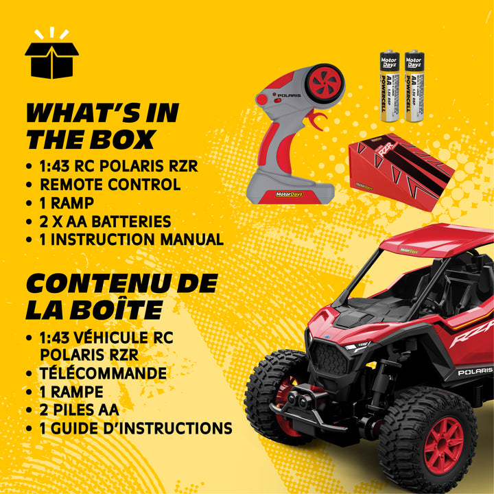 Toy Polaris RZR with remote control, batteries, and toolbox on a yellow background